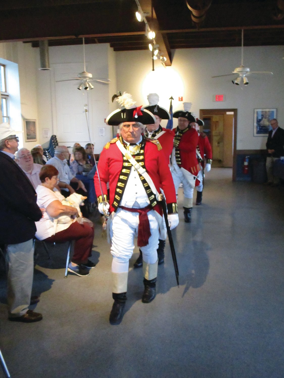 MAKING AN ENTRANCE: Members of the Pawtuxet Rangers led off last week’s ceremony, marching into the Aspray Boat House for a presentation of the colors